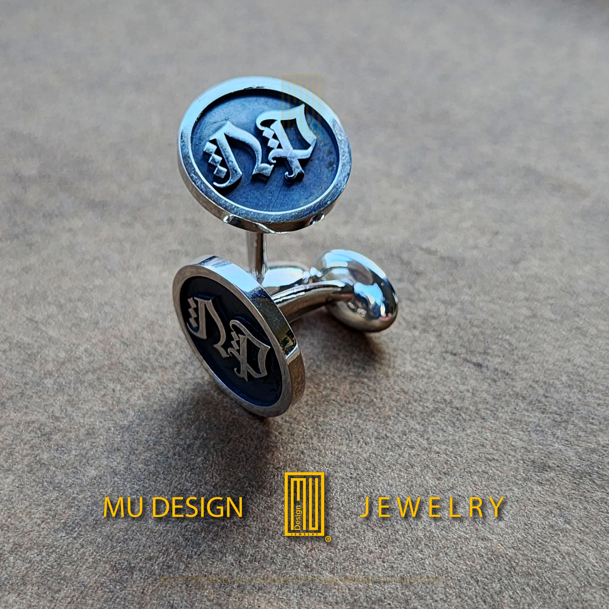 a close up of a pair of cuff links